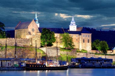 View of waterside fortress of Akershus at night