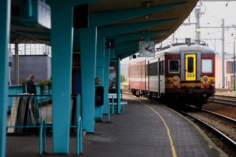 Belgian regional train leaving train station