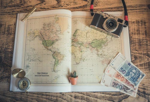 Everything about Eurail | Map, compass and Croatian money on the table