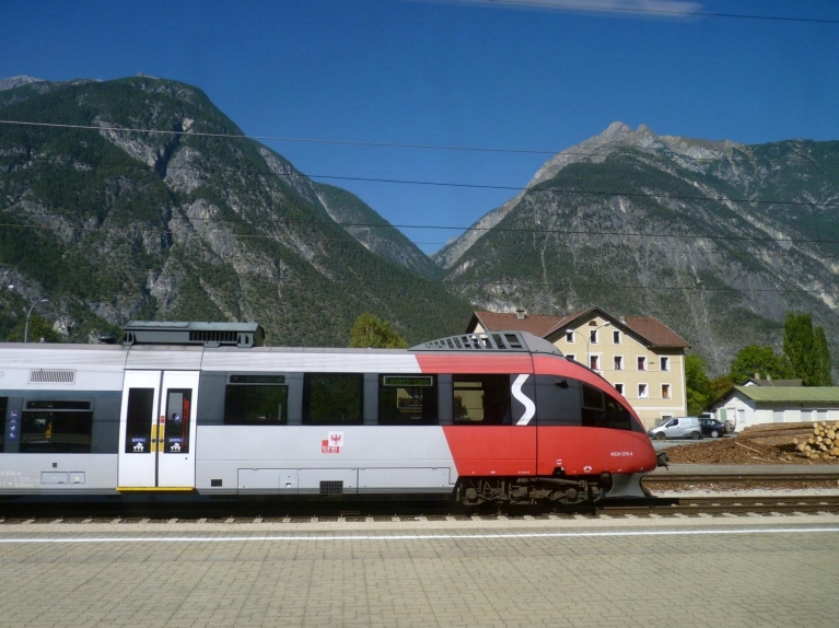 A regional train arrives in an Austrian mountain village