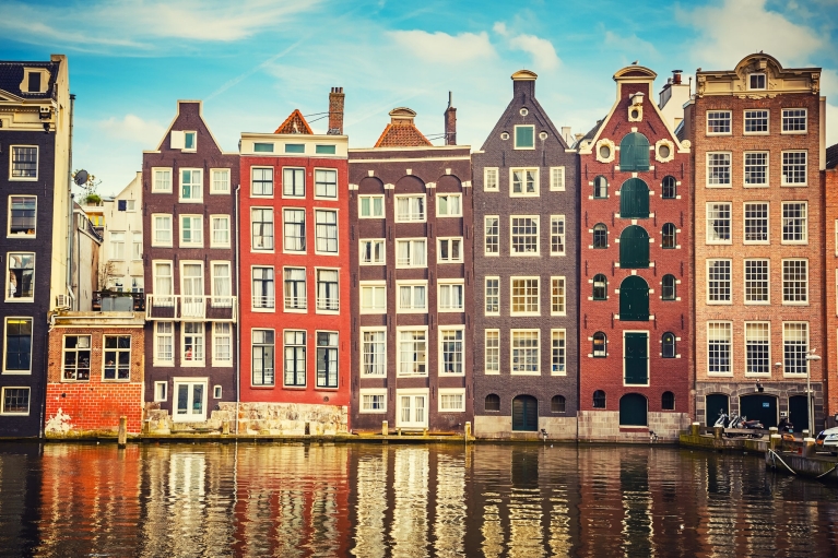 Tall, canal-side buildings in Amsterdam