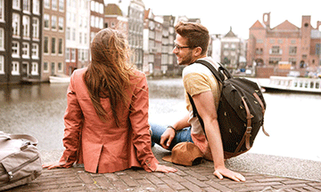 netherlands-amsterdam-couple-sitting-near-water